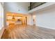 Open floor plan with kitchen and living area with hardwood flooring and natural light at 3681 Deaton Trl, Buford, GA 30519