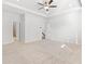 Expansive main bedroom with tray ceilings, neutral carpet, and ensuite bathroom entrance at 3681 Deaton Trl, Buford, GA 30519