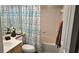 The bathroom features a shower-tub combo, sink vanity, and modern fixtures at 434 Bentley Place, Tucker, GA 30084