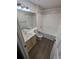 A bathroom showcases a double vanity, toilet, and tub with a shower combination at 434 Bentley Place, Tucker, GA 30084