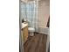 Bathroom featuring a vanity, a toilet, and a shower with a patterned curtain at 434 Bentley Place, Tucker, GA 30084