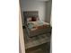 Bedroom featuring a comfortable bed, an area rug, and a doorway to the bathroom at 434 Bentley Place, Tucker, GA 30084