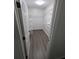 The closet offers ample storage space with metal shelves at 434 Bentley Place, Tucker, GA 30084