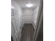 The closet offers ample storage space with metal shelves and lighting at 434 Bentley Place, Tucker, GA 30084