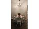 Charming dining area with a round table and decorative chandelier at 434 Bentley Place, Tucker, GA 30084
