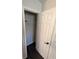 Bright entrance with a white front door and black hardware adjacent to a closet at 434 Bentley Place, Tucker, GA 30084