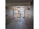 Well-lit hallway with textured walls leading to an outdoor balcony at 434 Bentley Place, Tucker, GA 30084