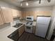 Bright kitchen featuring stainless steel appliances, ample counter space, and wood cabinets at 434 Bentley Place, Tucker, GA 30084