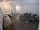 The spacious living room has new wood floors, and neutral colors at 434 Bentley Place, Tucker, GA 30084
