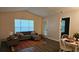 Cozy living room with modern furnishings and a large window offering natural light at 434 Bentley Place, Tucker, GA 30084