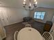 This bright living room has a dining space and plenty of natural light at 434 Bentley Place, Tucker, GA 30084