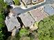 An aerial view displays the property, with its gray roof, nestled among other houses in a well-established neighborhood at 4782 Lakeway, Alpharetta, GA 30005