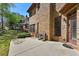 Brick house with outdoor patio and chairs overlooking a landscaped yard at 4782 Lakeway, Alpharetta, GA 30005