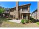 Brick house with outdoor patio overlooking a landscaped yard and mature trees at 4782 Lakeway, Alpharetta, GA 30005