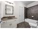 Clean bathroom featuring a single sink vanity and shower over tub at 4782 Lakeway, Alpharetta, GA 30005