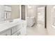 Bright bathroom with tile flooring, double sinks, and modern fixtures at 4782 Lakeway, Alpharetta, GA 30005