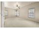 Spacious bedroom featuring neutral carpet and multiple windows at 4782 Lakeway, Alpharetta, GA 30005