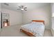 Light-filled bedroom featuring a window, fan, neutral carpet, and a bright aesthetic at 4782 Lakeway, Alpharetta, GA 30005