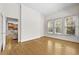 Bonus room with hardwood floors and natural light, with view into the adjacent kitchen at 4782 Lakeway, Alpharetta, GA 30005