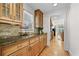 Eat-in kitchen featuring custom cabinets, granite countertops and hardwood floors at 4782 Lakeway, Alpharetta, GA 30005