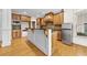 Charming kitchen with a large island, custom cabinetry, stainless refrigerator, and hardwood floors at 4782 Lakeway, Alpharetta, GA 30005