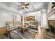Bright, open living room with hardwood floors, coffered ceilings and fireplace, open to the kitchen at 4782 Lakeway, Alpharetta, GA 30005