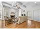 Comfortable living room with hardwood floors, a fireplace, coffered ceilings, and ample natural light at 4782 Lakeway, Alpharetta, GA 30005