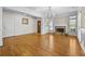 Open living room featuring hardwood floors, a stone fireplace, and ample natural light at 4782 Lakeway, Alpharetta, GA 30005