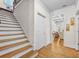 Bright staircase featuring hardwood steps and flooring plus views to other rooms at 4782 Lakeway, Alpharetta, GA 30005