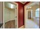 Ensuite bath and walk-in closet featuring a tile floor and separate tub at 4981 Millwood Dr, Canton, GA 30114