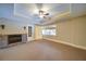 Spacious bedroom with neutral tones, tray ceiling and large window, and fireplace at 4981 Millwood Dr, Canton, GA 30114