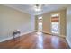 Spacious bedroom with hardwood floors, neutral walls, white trim, and lots of natural light at 4981 Millwood Dr, Canton, GA 30114