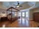 Bedroom suite featuring a four poster bed and hardwood floors at 4981 Millwood Dr, Canton, GA 30114