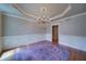 Dining room with hardwood floors, decorative chandelier, wainscotting, and trey ceiling at 4981 Millwood Dr, Canton, GA 30114