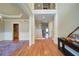 Spacious foyer with hardwood floors, white columns, and a staircase leading to the second floor at 4981 Millwood Dr, Canton, GA 30114