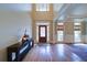 Grand foyer with hardwood floors, a decorative console table, and a statement front door at 4981 Millwood Dr, Canton, GA 30114