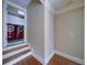 Hallway steps leading to laundry room featuring red washer and dryer units at 4981 Millwood Dr, Canton, GA 30114
