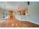 Kitchen with hardwood floors, stainless steel appliances, granite counters, and ample storage at 4981 Millwood Dr, Canton, GA 30114