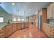 Kitchen features stainless steel appliances, hardwood floors, granite counters and wooden cabinets at 4981 Millwood Dr, Canton, GA 30114