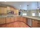 Kitchen with granite counters, stainless steel appliances, and hardwood floors at 4981 Millwood Dr, Canton, GA 30114