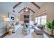 Inviting living room with brick fireplace, beamed ceilings, and stylish modern furnishings at 4981 Millwood Dr, Canton, GA 30114