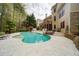 Inviting outdoor pool area with sun loungers and a lush, landscaped backyard at 4981 Millwood Dr, Canton, GA 30114