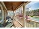 Relaxing porch with elegant ceiling fan, comfortable seating, beautiful plants and a view of the landscaped front yard at 4981 Millwood Dr, Canton, GA 30114
