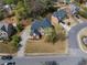 An aerial view showcases the home's prime location, lush landscaping, and spacious driveway at 2924 Meadow Church Rd, Suwanee, GA 30024