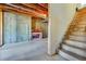 Unfinished basement with concrete walls, exposed ceiling, and stairs at 2924 Meadow Church Rd, Suwanee, GA 30024