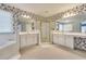 Well-lit bathroom with a large shower, tub, and double vanity, accented with patterned wallpaper at 2924 Meadow Church Rd, Suwanee, GA 30024