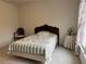 Comfortable bedroom featuring a twin bed with a decorative quilt and vintage furniture at 2924 Meadow Church Rd, Suwanee, GA 30024