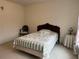 Comfortable bedroom featuring a twin bed with a decorative quilt and vintage furniture at 2924 Meadow Church Rd, Suwanee, GA 30024