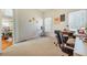 Bedroom with neutral carpet, desk, and open doorway into the kitchen at 2924 Meadow Church Rd, Suwanee, GA 30024