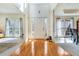 Bright foyer with hardwood floors, complemented by natural light and neutral decor at 2924 Meadow Church Rd, Suwanee, GA 30024